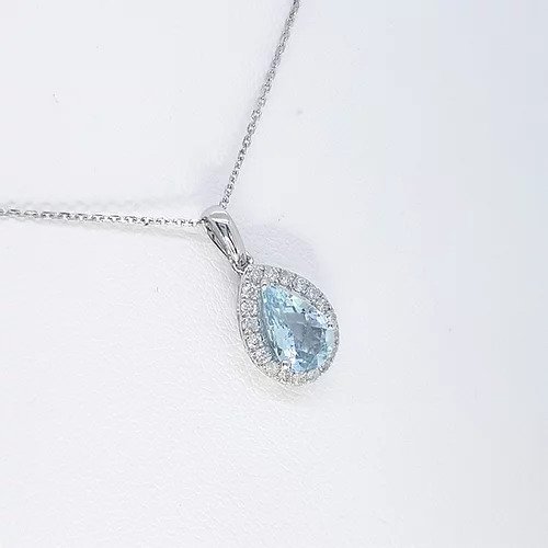 Aquamarine and Diamond Pear Shaped Cluster Pendant; 1.13ct pear cut aquamarine surrounded by 0.21cts brilliant cut diamonds, in 9ct white gold