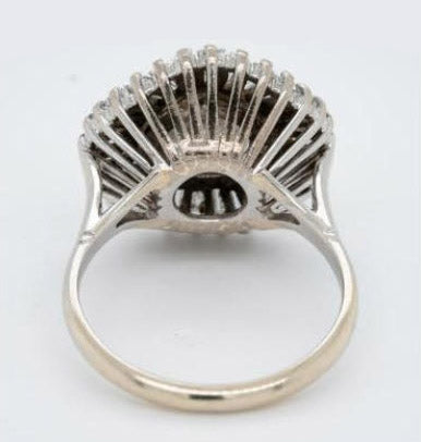 Old Cut Diamond Ballerina Cluster Ring; central 1.80 carat old European-cut diamond surrounded by 1.50 carats of tapering baguette-cut diamonds