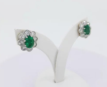 Emerald and Diamond Oval Cluster Stud Earrings; featuring 1.50cts oval emeralds surrounded by 1.30cts diamonds, in 18ct white and yellow gold