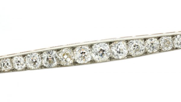 Art Deco Old Cut Diamond Bar Brooch; set with 1.20 carats of graduating old-cut diamonds. Mounted in platinum and backed with 18ct yellow gold. Circa 1920s