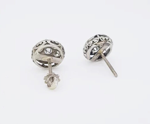 A pair of vintage Diamond Floral Cluster Stud Earrings, 1.80 carat total, mounted in platinum, pierced mount, screw back butterfly fittings