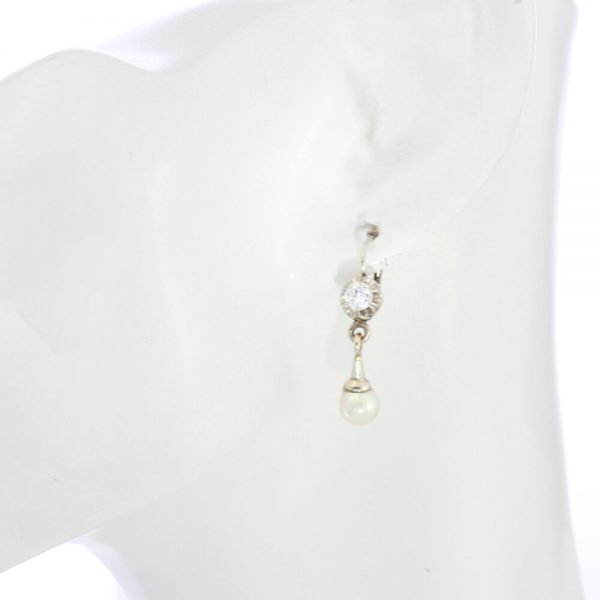 Vintage Pearl and Diamond Drop Earrings; set with freshwater cultured pearls and 0.50cts diamonds mounted in 18ct White Gold, Circa 1950s