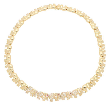 Diamond and ruby walking elephant necklace in gold.