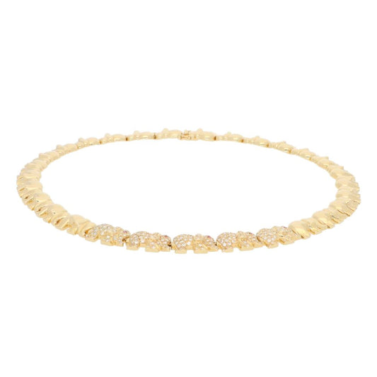 Diamond and ruby walking elephant necklace in gold.