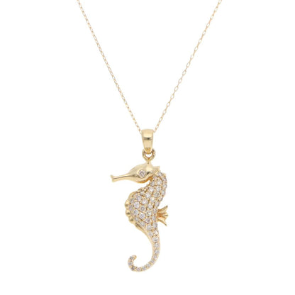 Diamond seahorse pendant necklace in gold.