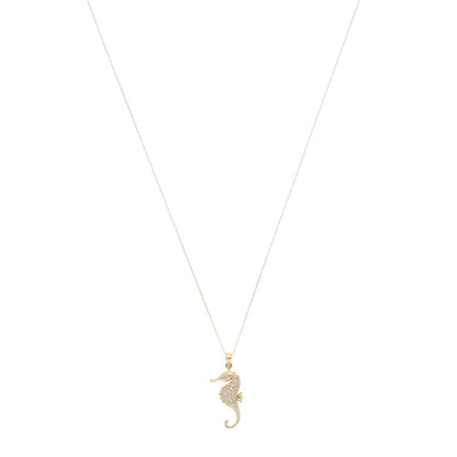 Diamond seahorse pendant necklace in gold.