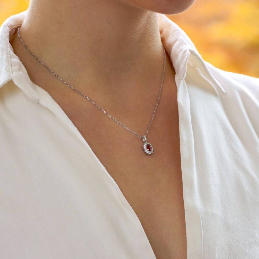 0.54ct Ruby and Diamond Oval Cluster Pendant in 18ct White Gold