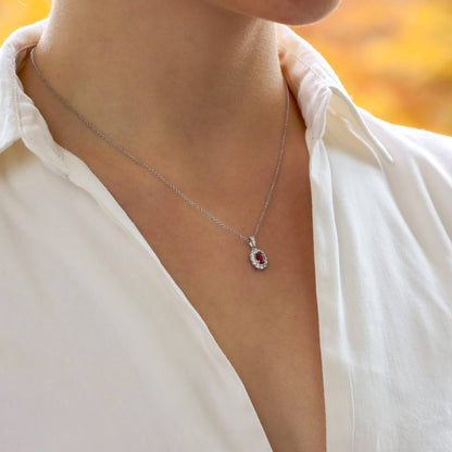 0.54ct Ruby and Diamond Oval Cluster Pendant in 18ct White Gold