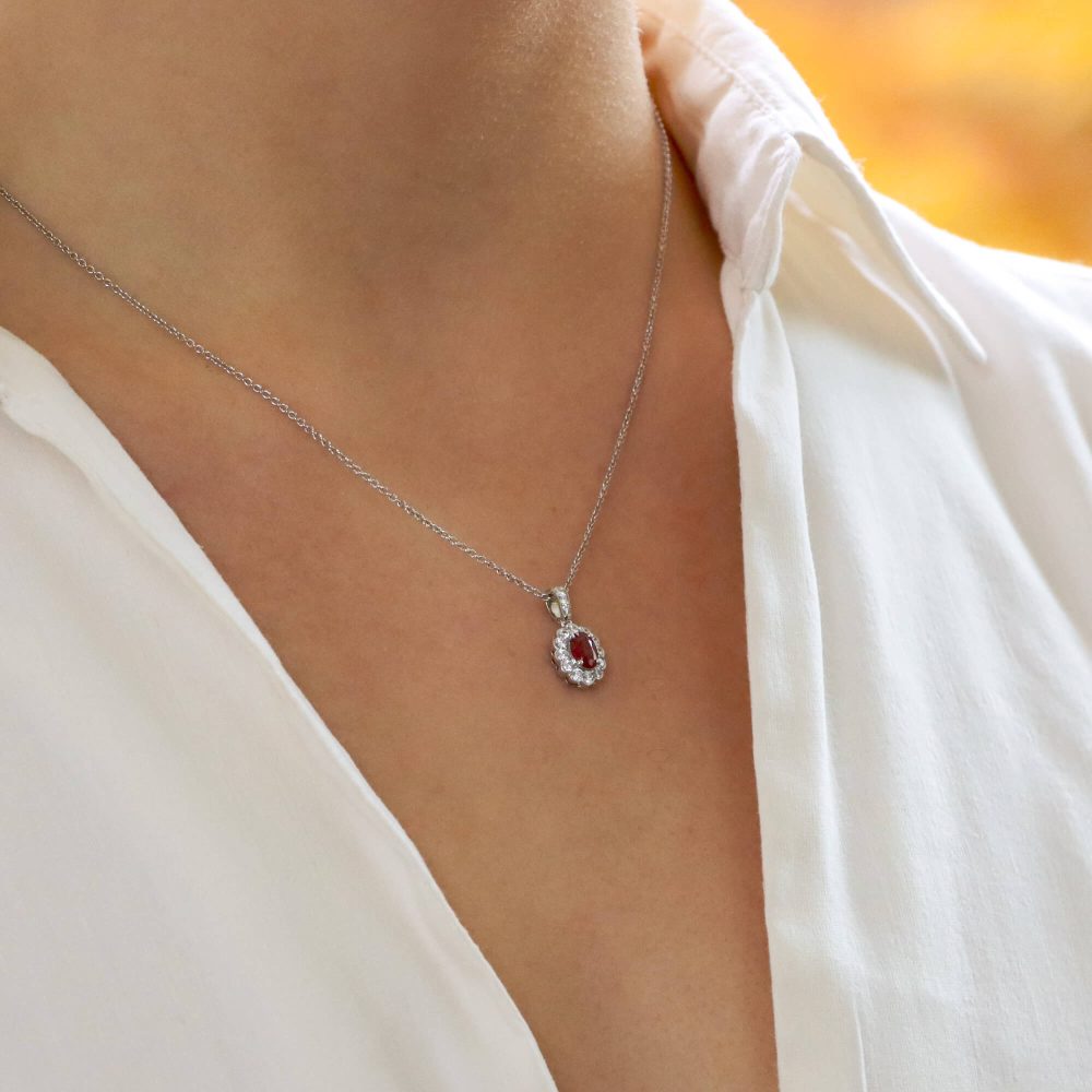 0.54ct Ruby and Diamond Oval Cluster Pendant in 18ct White Gold