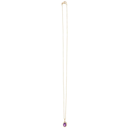 A yellow gold amethyst pendant on a gold chain, on a white background