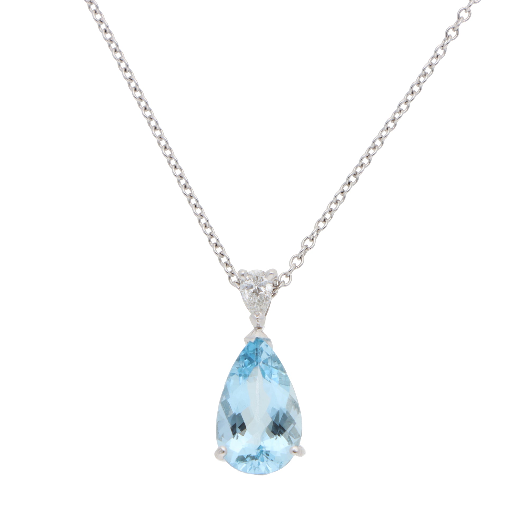A pear shaped aquamarine and diamond pendant on a white gold chain, on a white background