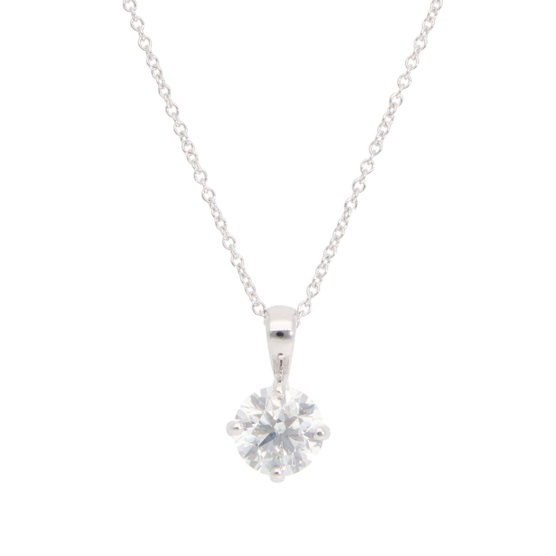 Diamond solitaire pendant necklace in white gold.