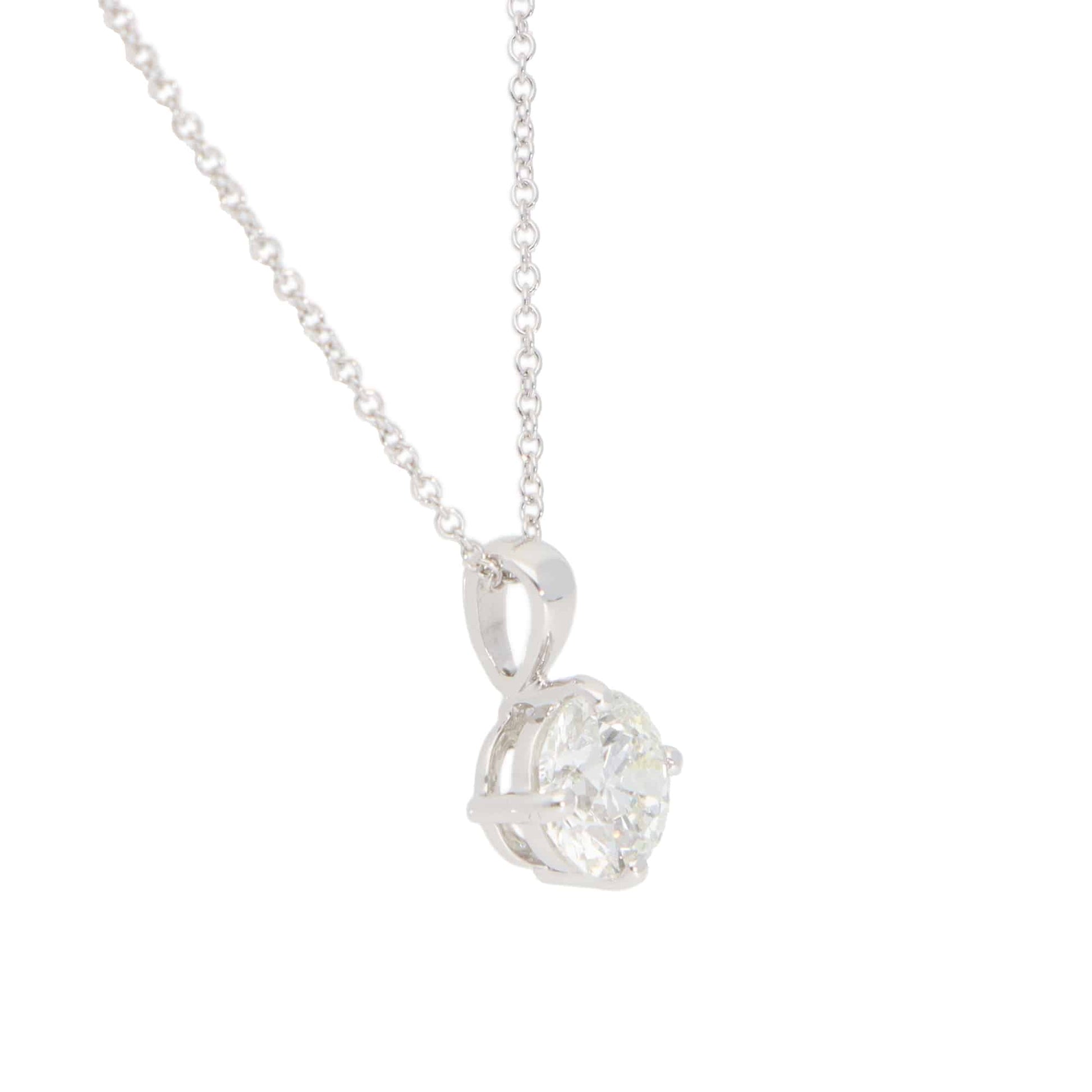 Diamond solitaire pendant necklace in white gold.