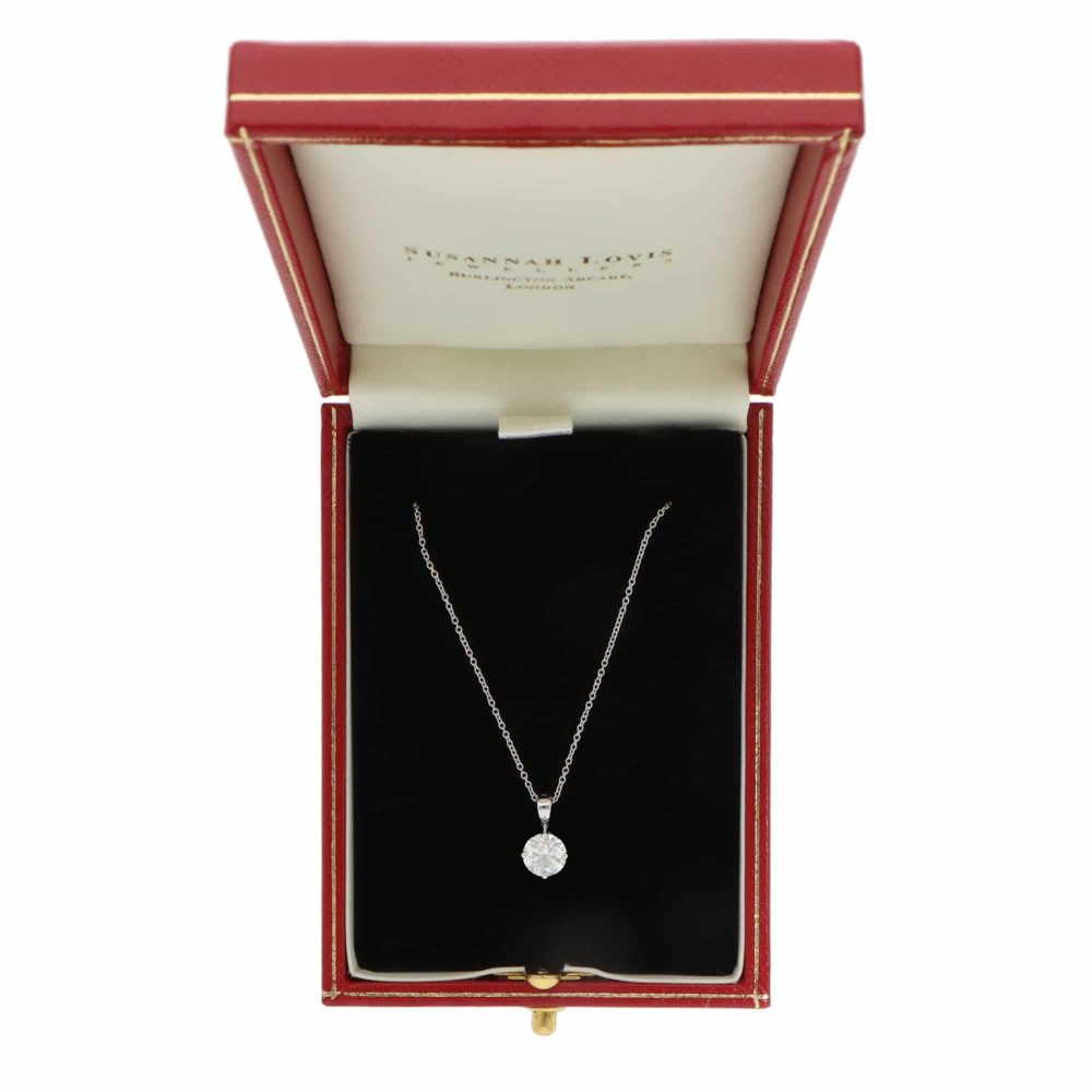 Diamond solitaire pendant necklace in white gold.