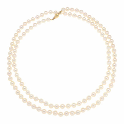Akoya pearl necklace with a gold barrel clasp.