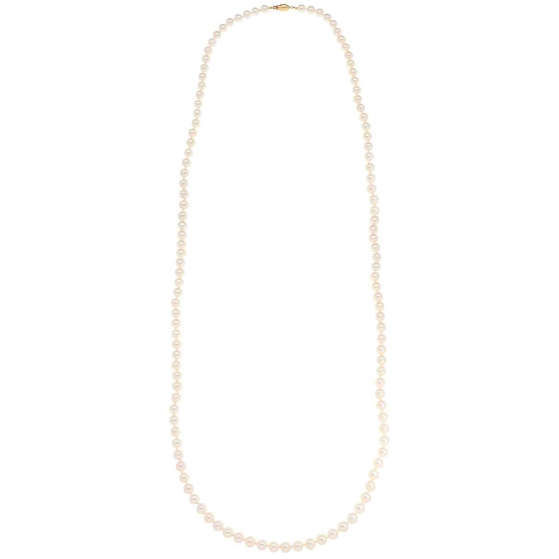 Akoya pearl necklace with a gold barrel clasp.