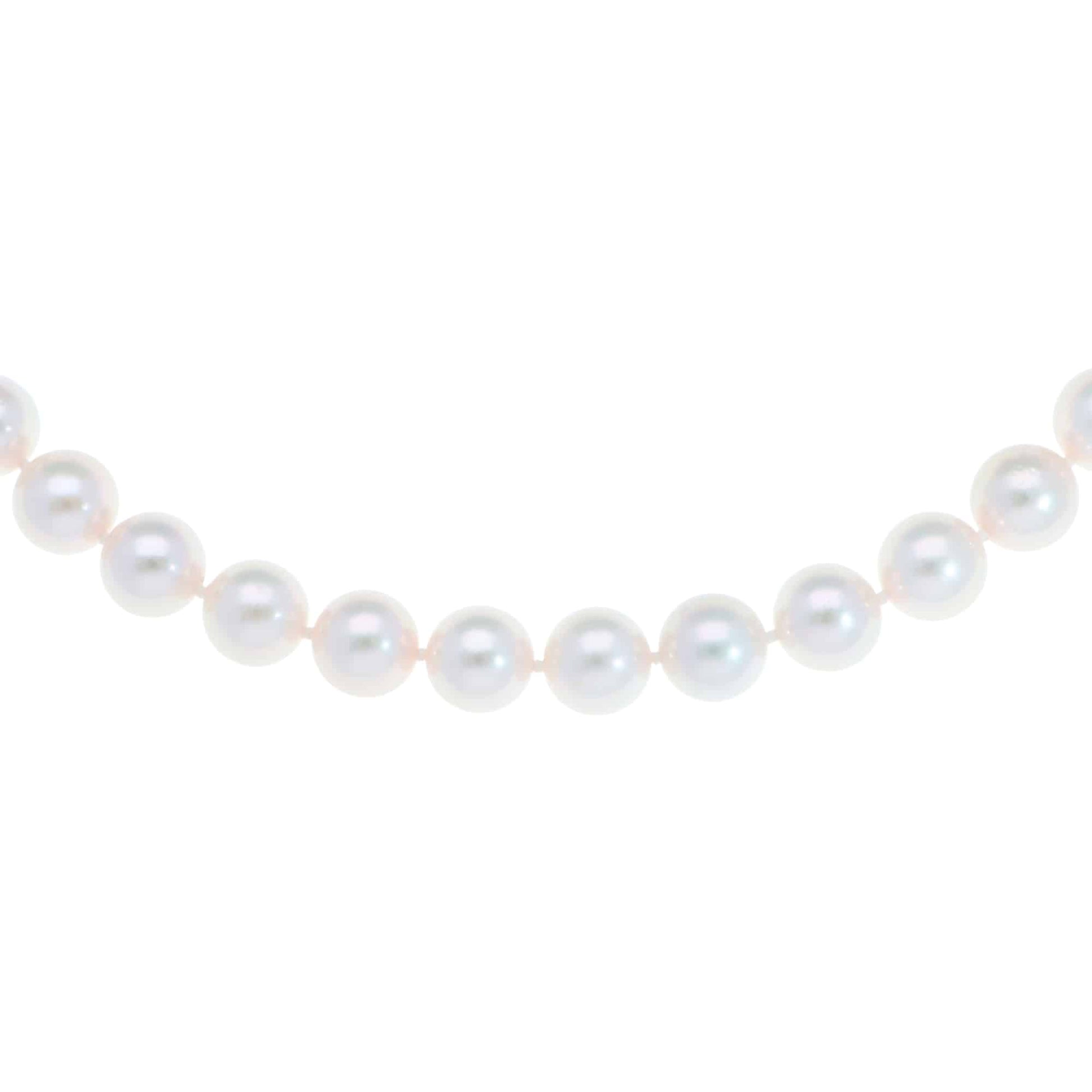 Akoya pearl necklace with a vintage ridged barrel clasp in gold.