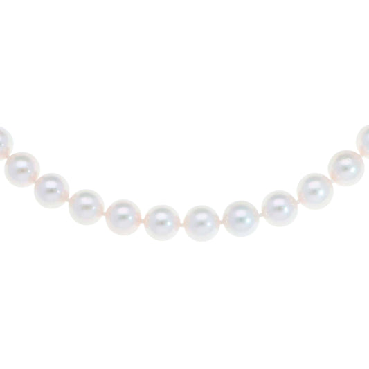 Akoya pearl necklace with a vintage ridged barrel clasp in gold.