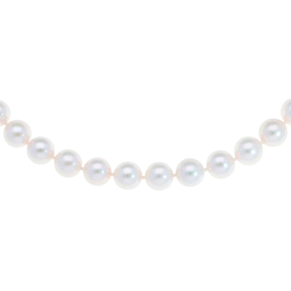 Akoya pearl necklace with a vintage ridged barrel clasp in gold.