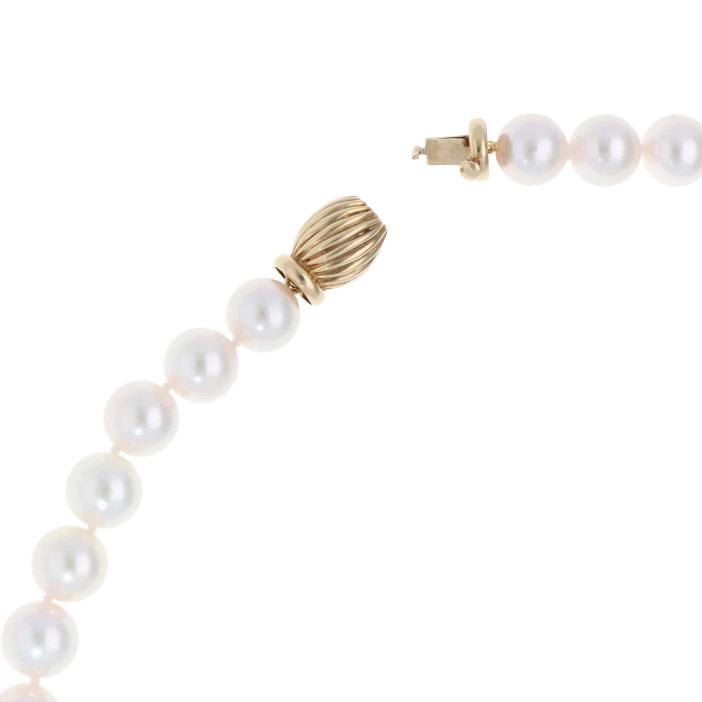 Akoya pearl necklace with a vintage ridged barrel clasp in gold.