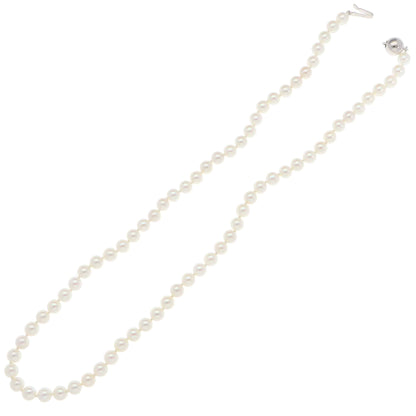 A white pearl single row necklace with a white gold clasp, on a white background