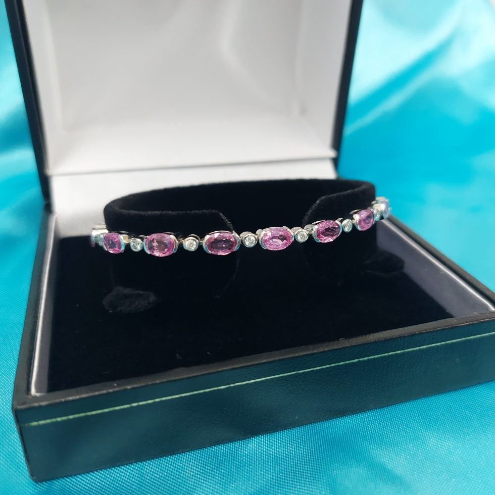 Oval pink sapphire and diamond bracelet