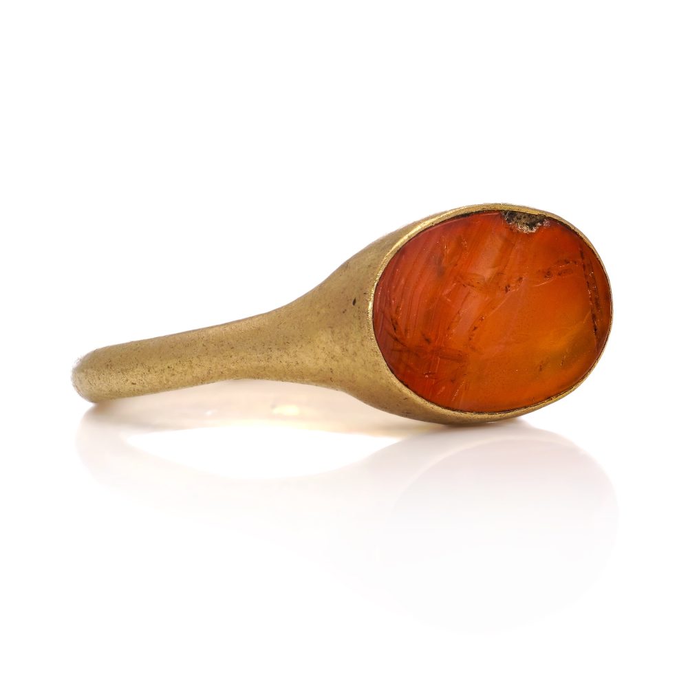 Roman carnelian intaglio ring set in 22 ct yellow gold, circa 100 - 300 AD.