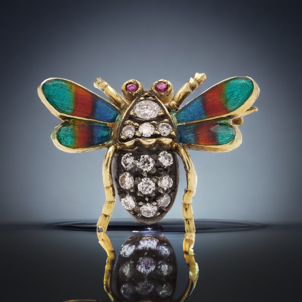 Antique insect brooch in gold and silver set with diamonds enamel and rubies. 