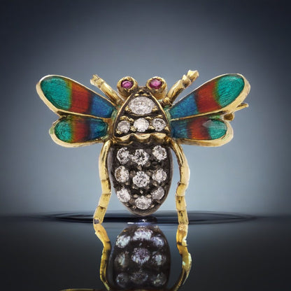 Antique insect brooch in gold and silver set with diamonds enamel and rubies. 