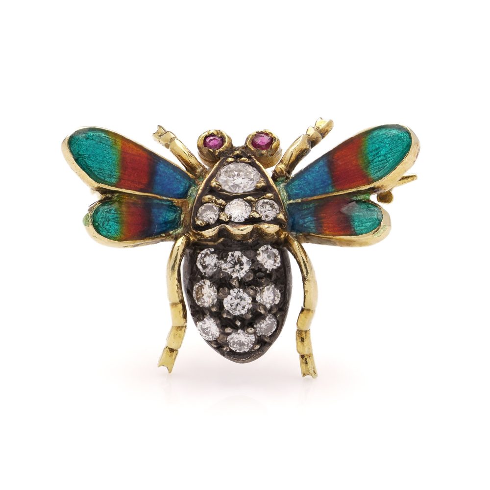 Antique insect brooch in gold and silver set with diamonds enamel and rubies. 