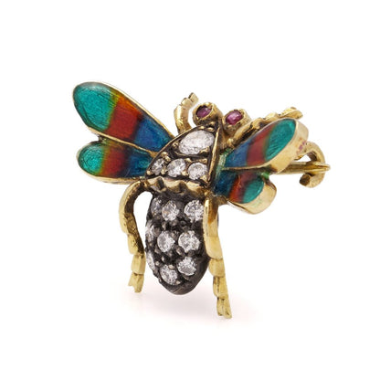 Antique insect brooch in gold and silver set with diamonds enamel and rubies. 