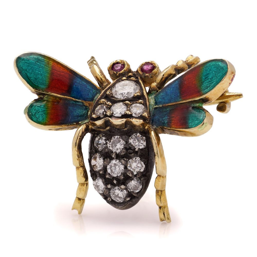 Antique insect brooch in gold and silver set with diamonds enamel and rubies. 