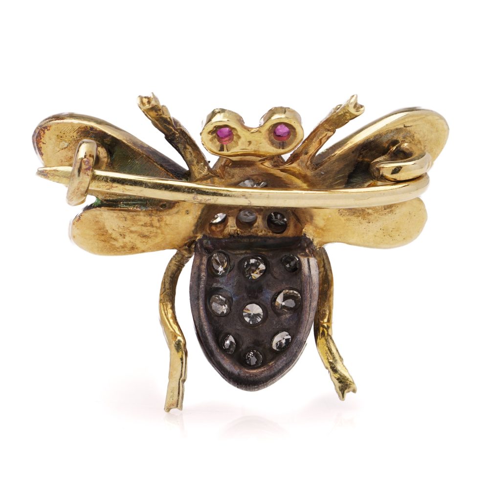 Antique insect brooch in gold and silver set with diamonds enamel and rubies. 