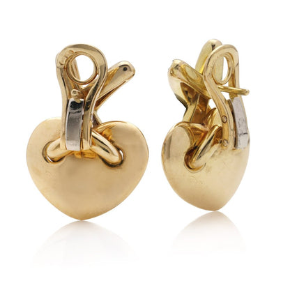 Chaumet gold heart-shaped clip earrings with X design set with diamonds.