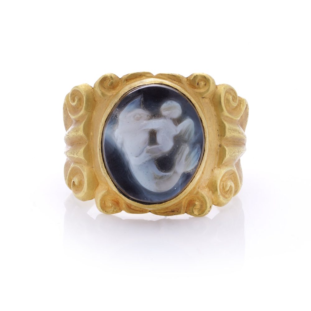 Antique Chalcedony Cameo and 22ct Yellow Gold Ring featuring Eros Cupid riding a dolphin. 19th century Circa 1890s