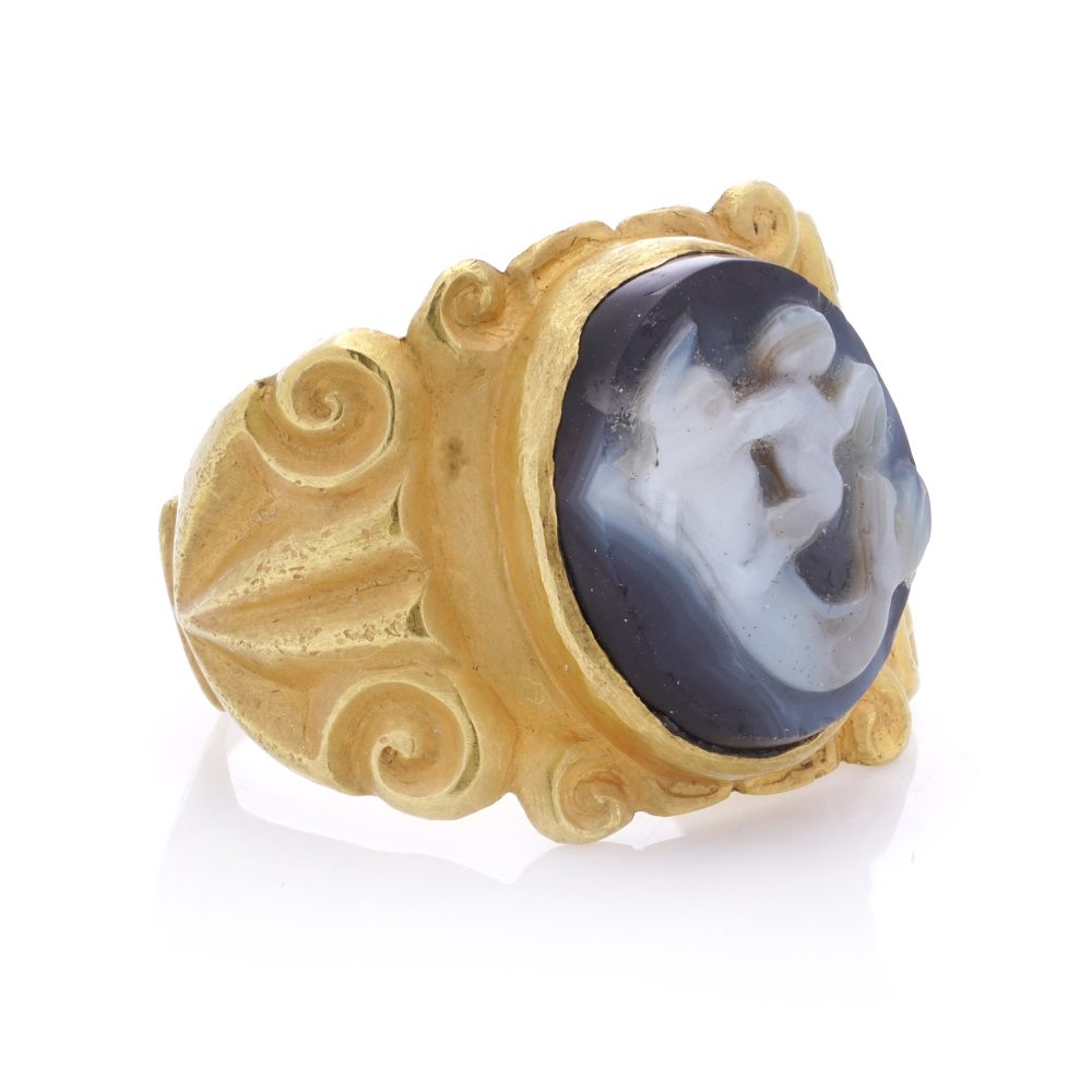 Antique Chalcedony Cameo and 22ct Yellow Gold Ring featuring Eros Cupid riding a dolphin. 19th century Circa 1890s
