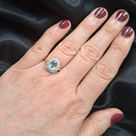 0.80ct Oval Aquamarine and 1.10ct Diamond Cluster Engagement Ring in 18ct Yellow Gold