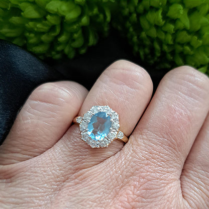 0.80ct Oval Aquamarine and 1.10ct Diamond Cluster Engagement Ring in 18ct Yellow Gold