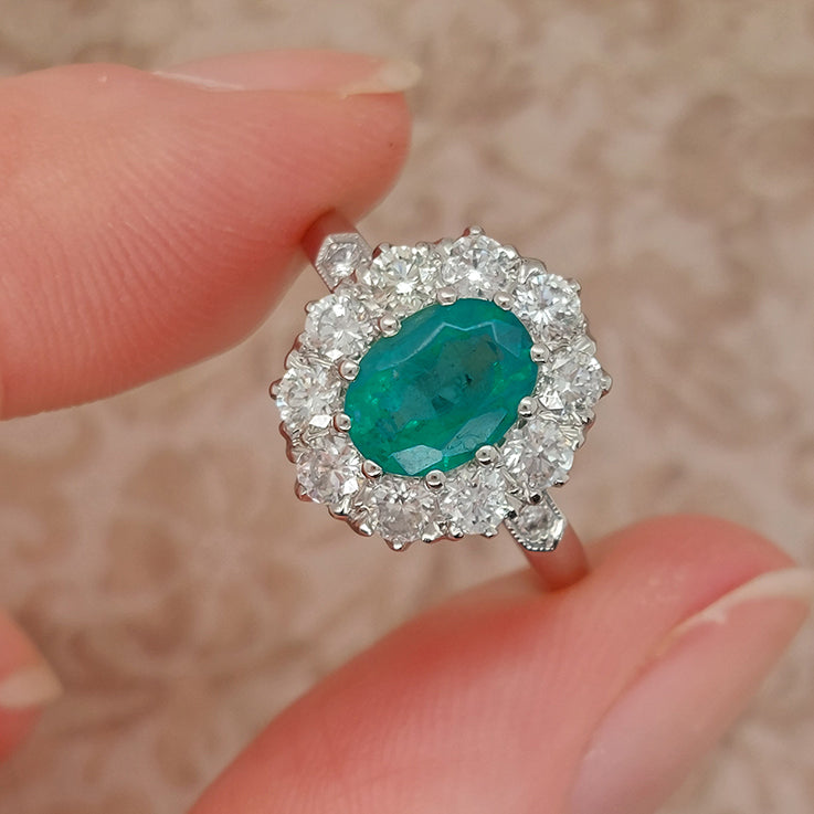 1.31ct Oval Emerald and Diamond Cluster Engagement Ring in Platinum