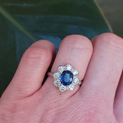 Oval Sapphire and Diamond Cluster Engagement Ring in Platinum