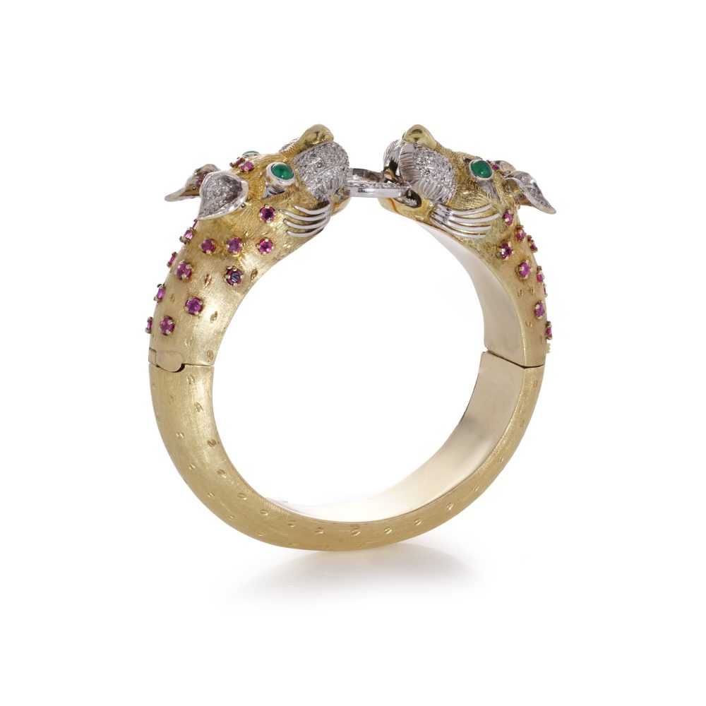 Larry dragon head gold bangle with diamonds, emeralds, and rubies.