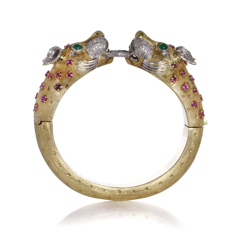 Larry dragon head gold bangle with diamonds, emeralds, and rubies.
