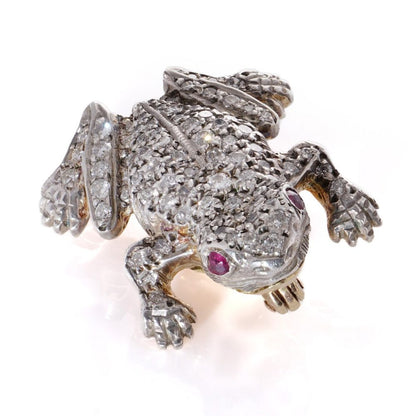 An Edwardian frog brooch in gold and silver set with diamonds and rubies.