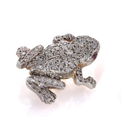 An Edwardian frog brooch in gold and silver set with diamonds and rubies.
