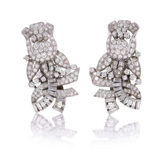 Diamond, platinum and gold double-clip/pendant flower-shaped brooch.