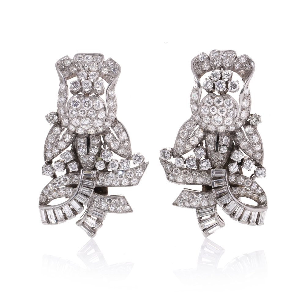 Diamond, platinum and gold double-clip/pendant flower-shaped brooch.