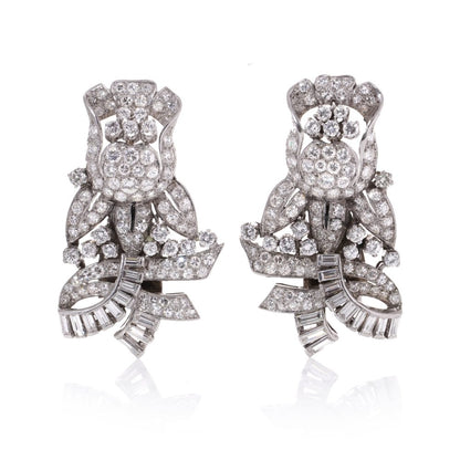 Diamond, platinum and gold double-clip/pendant flower-shaped brooch.