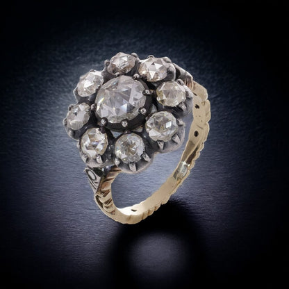 Diamond daisy cluster ring in gold and silver.