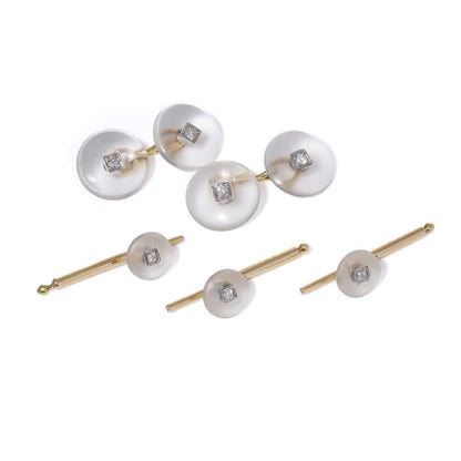 Cartier cufflinks and shirt studs in gold and platinum with rock crystals and diamonds.