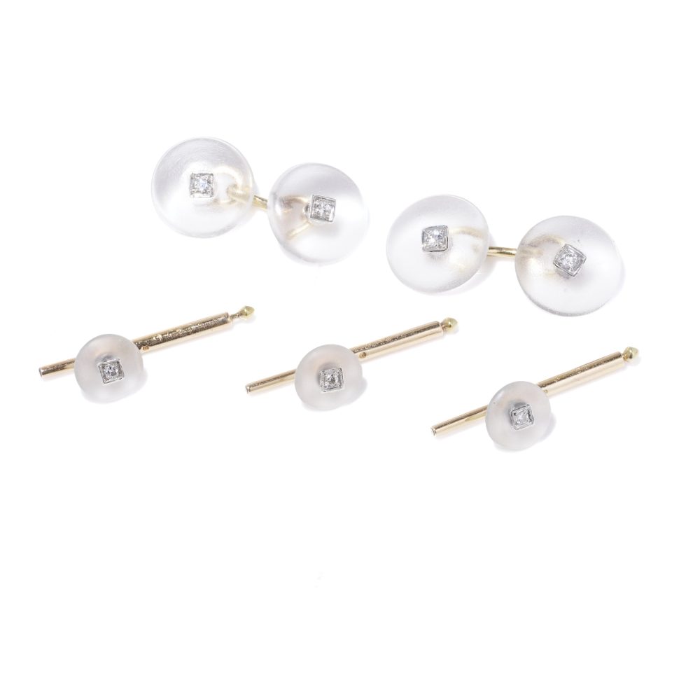 Cartier cufflinks and shirt studs in gold and platinum with rock crystals and diamonds.